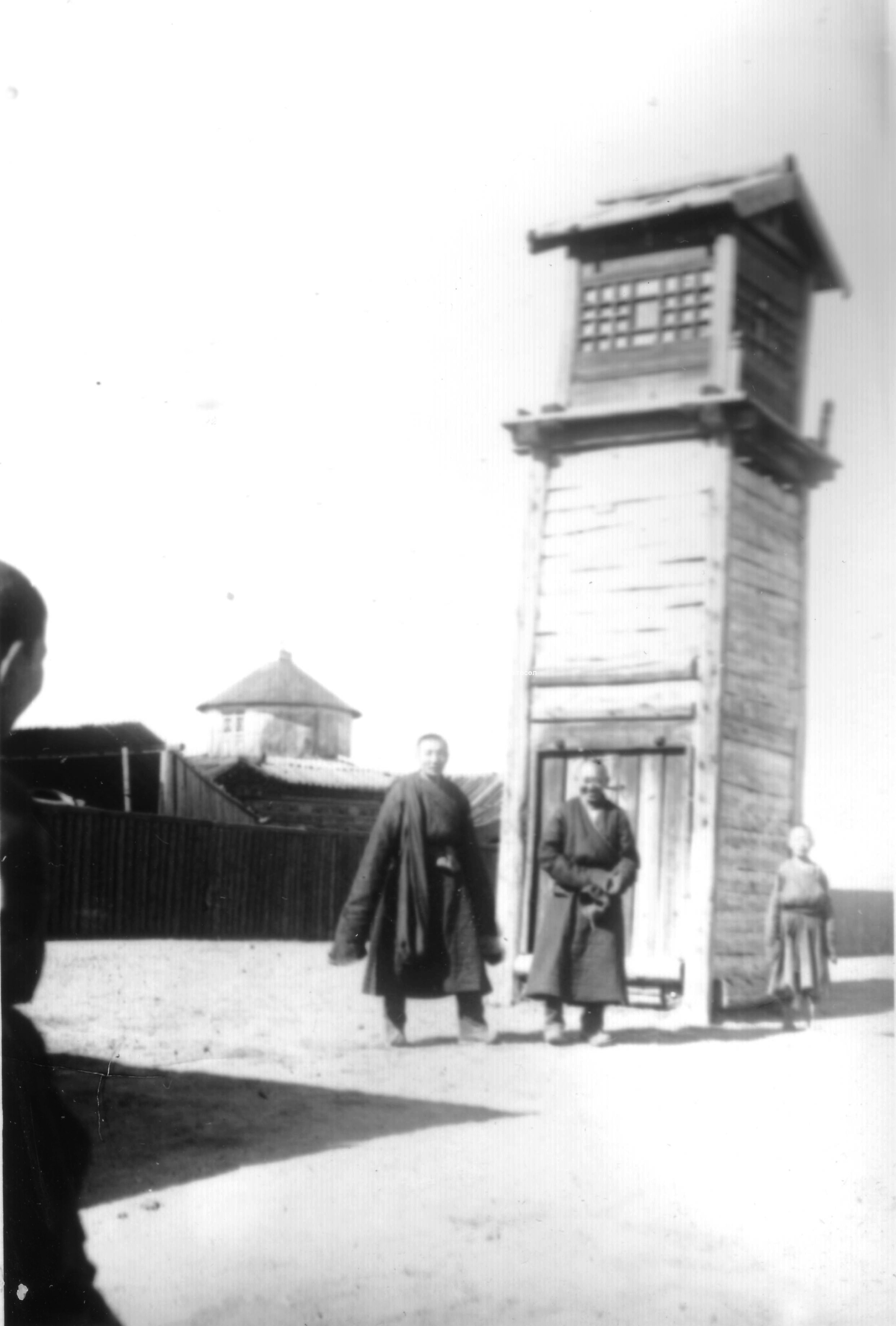 Tower (for butter lamps) and monks. Film Archives K-23768,  taken by Kondratyev in the 1920s